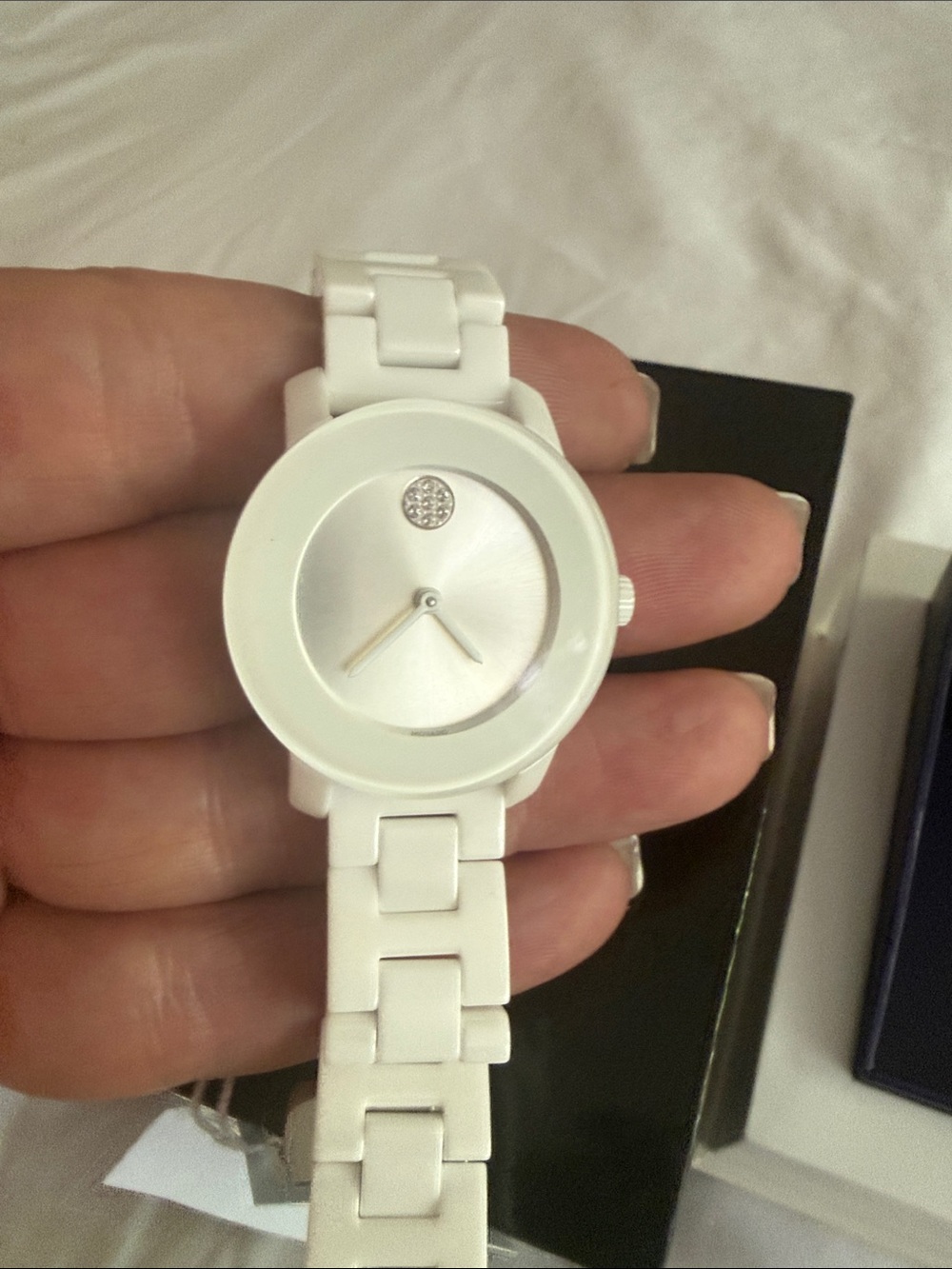 New Movado white watch.  Adjustable clasp.